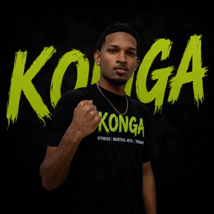 Coach Sameer holding a boxing stance in front of the Konga logo