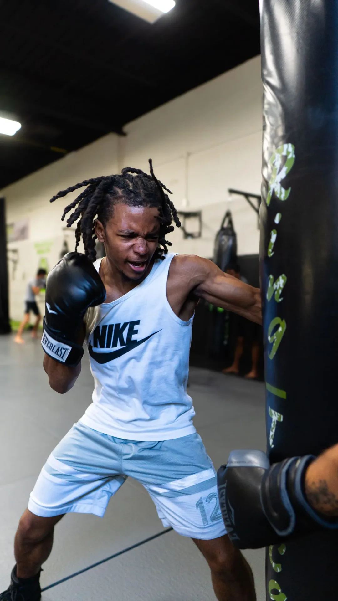 Boxer practising punches on a heavy bag