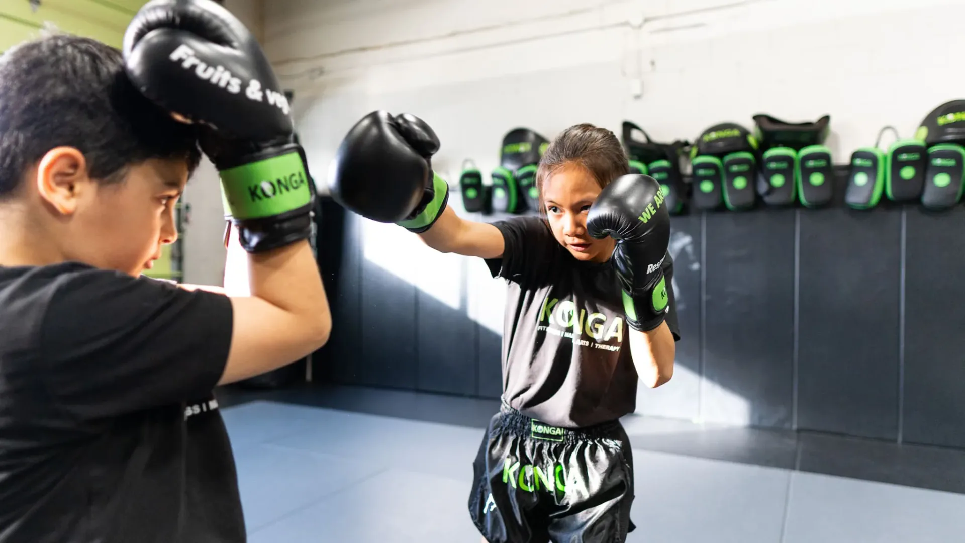 Two children practising boxing together