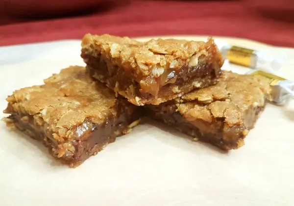Stack of chocolate and caramel oat bars