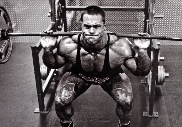 Weightlifter performing a heavy barbell squat