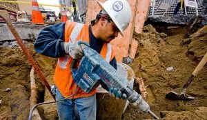 Construction worker operating a jackhammer