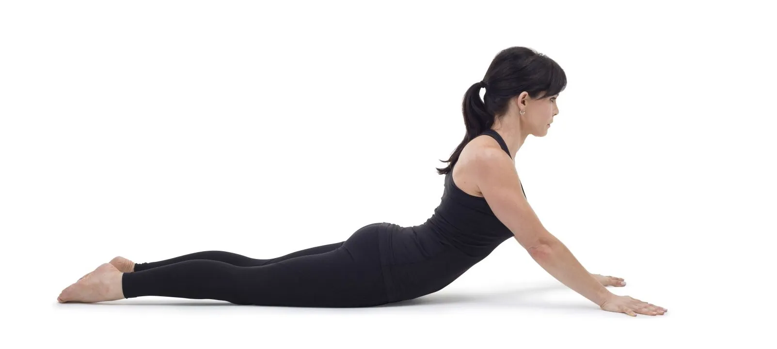 Woman lifting her chest from the floor in a back extension stretch