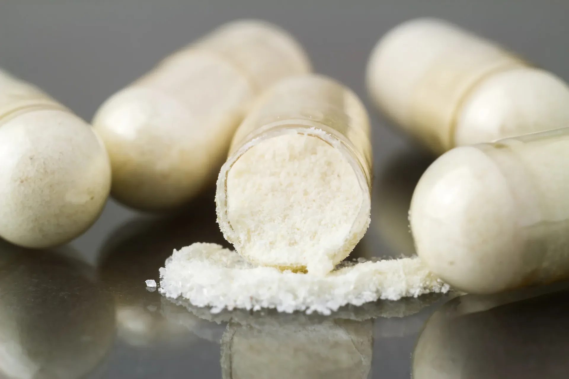 Close-up of white supplement tablets