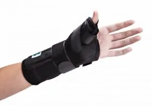 Hand and wrist supported by a black brace