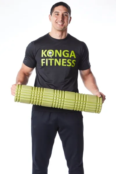 Dr. Amr El Bouse holding a foam roller