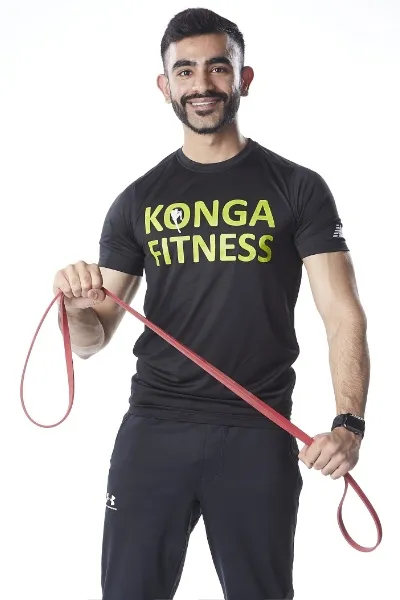 Hammad Mahmud holding a resistance band