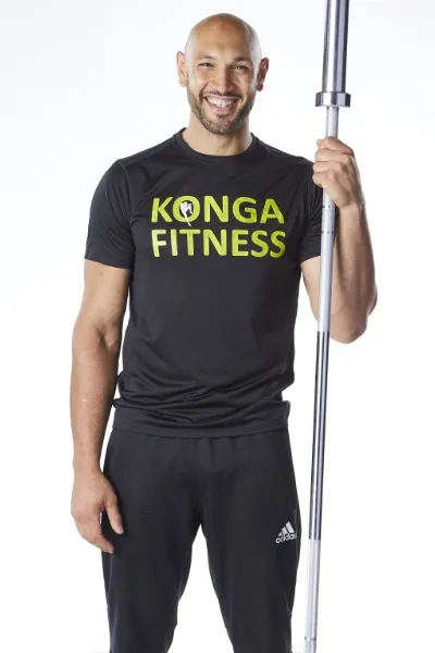 Fahim holding a barbell upright