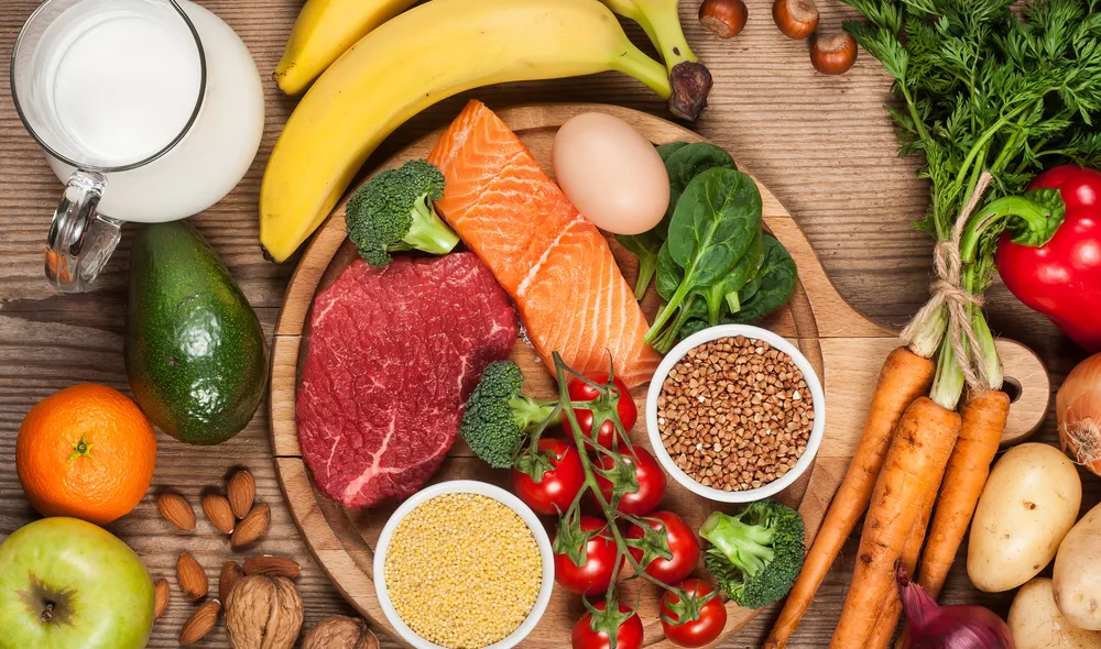 Assortment of vegetables, fruit, grains, meat, fish and eggs