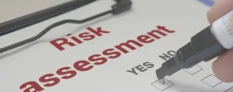 Risk-assessment form being completed with a pen