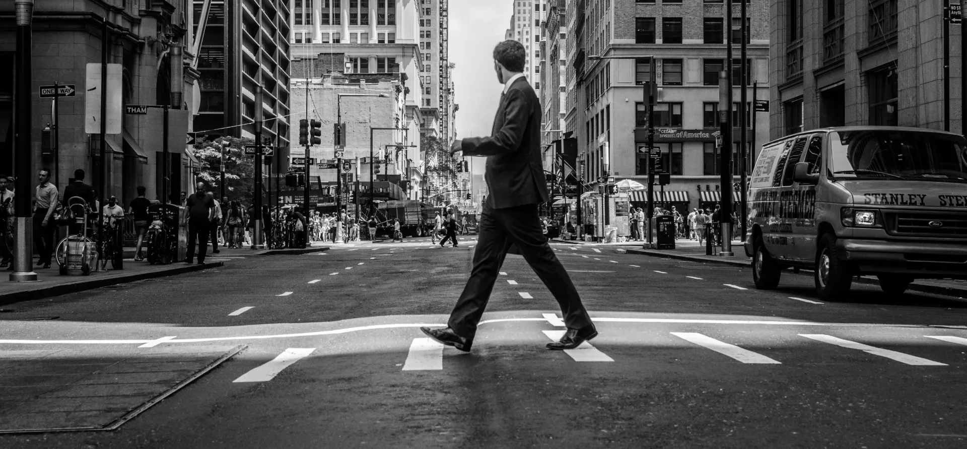 Pedestrian crossing a busy city street