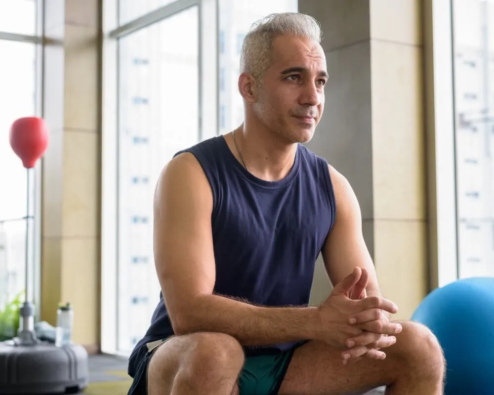 Man seated on an exercise ball