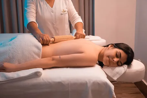 Practitioner massaging a client's back