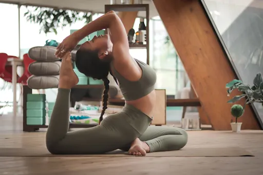 Woman performing a seated overhead stretch
