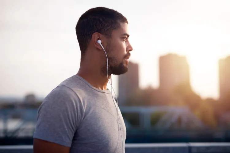 Man wearing earphones outdoors