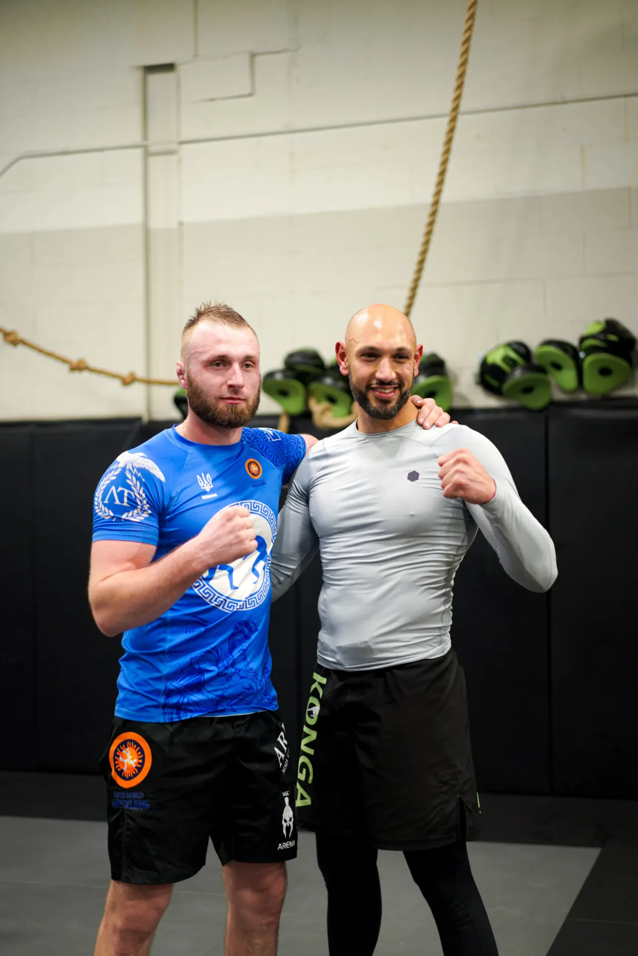 Two members posing together after training